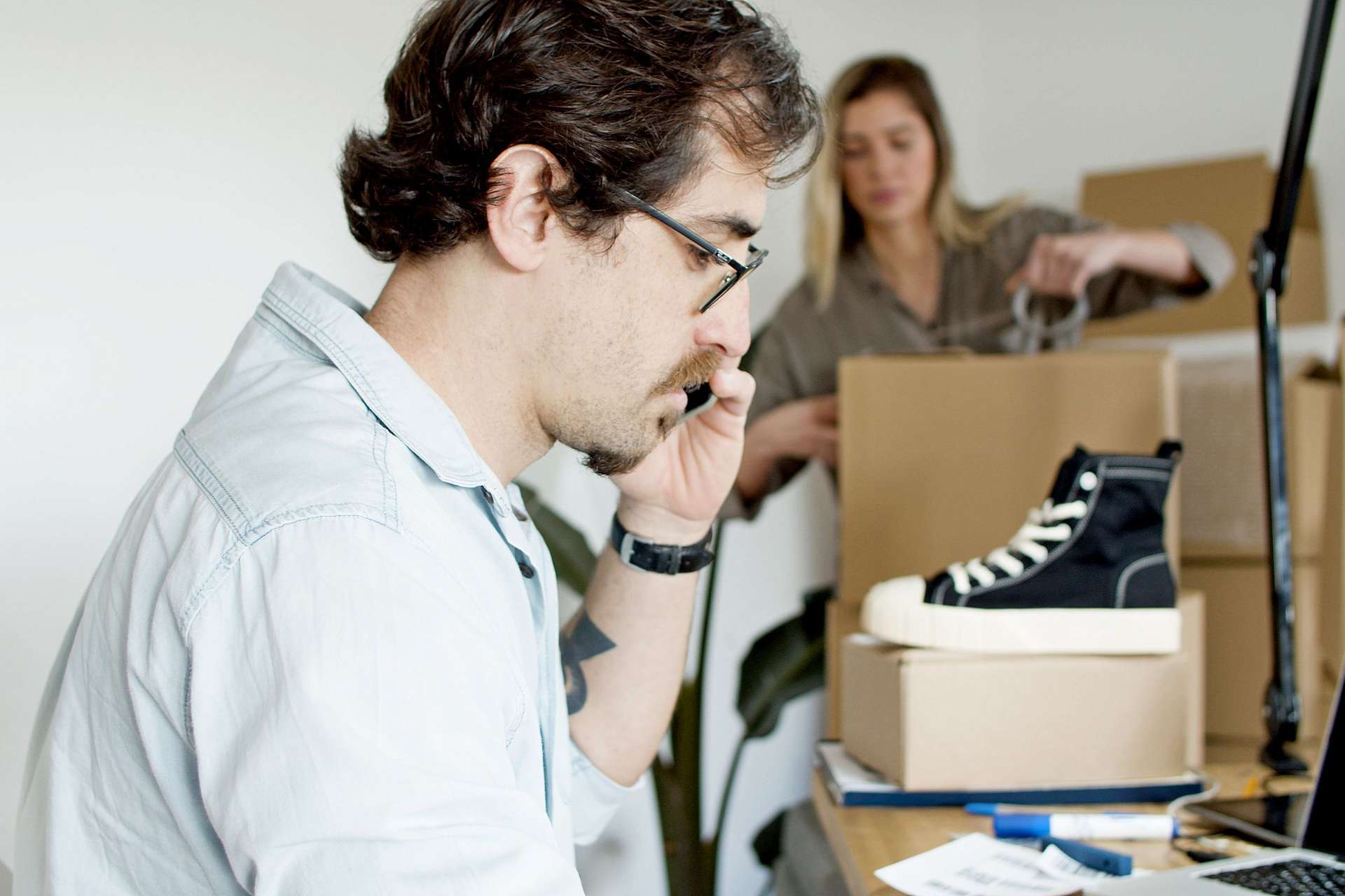 Small business owners preparing ecommerce orders for customers in Oman