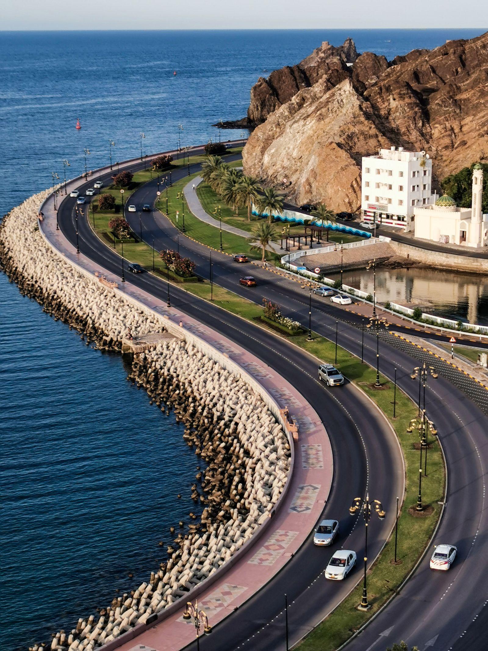 Omani business manager using a laptop to choose the best ERP system in the Sultanate of Oman