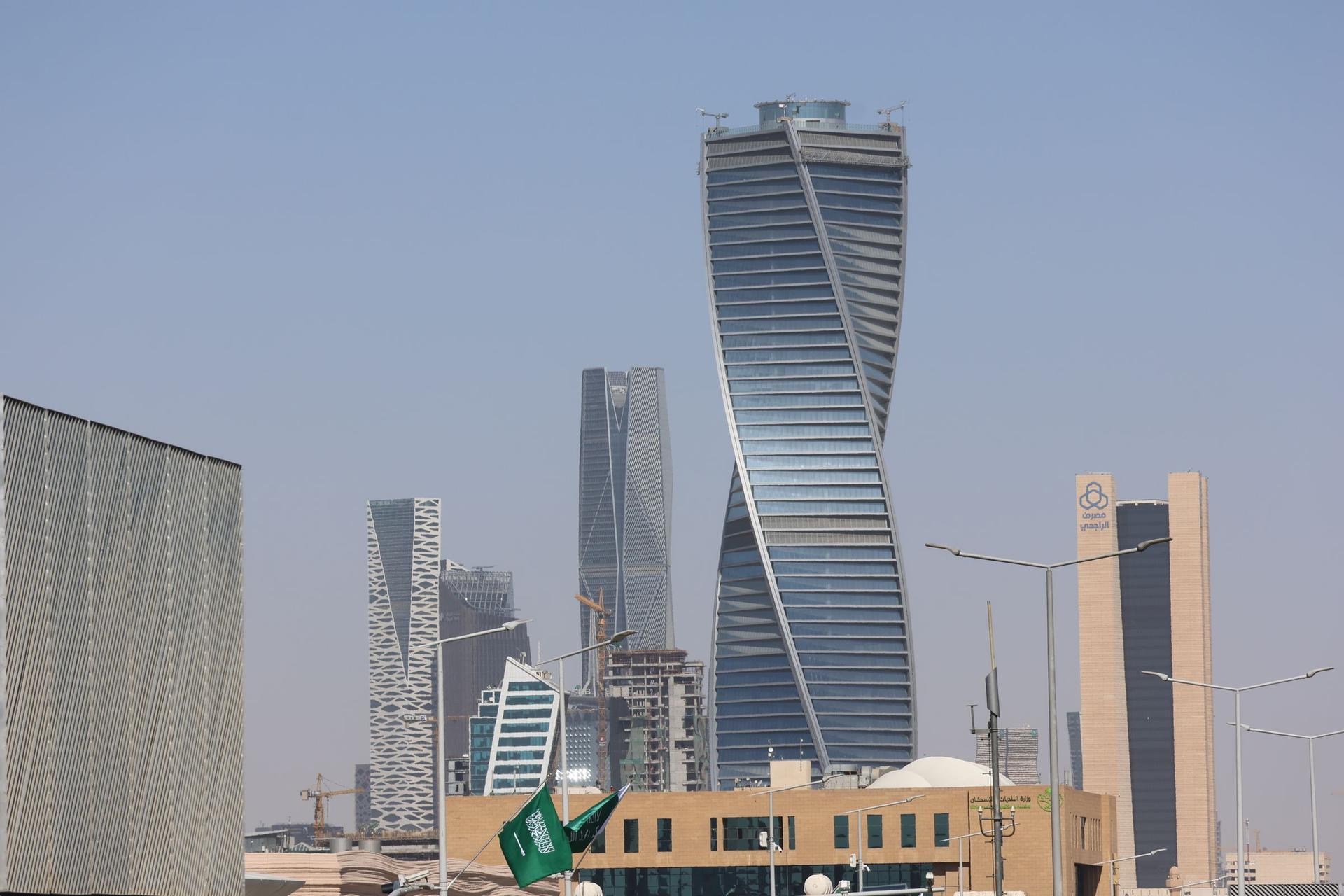 Modern Riyadh skyline and Saudi flags for choosing the best software company in Riyadh
