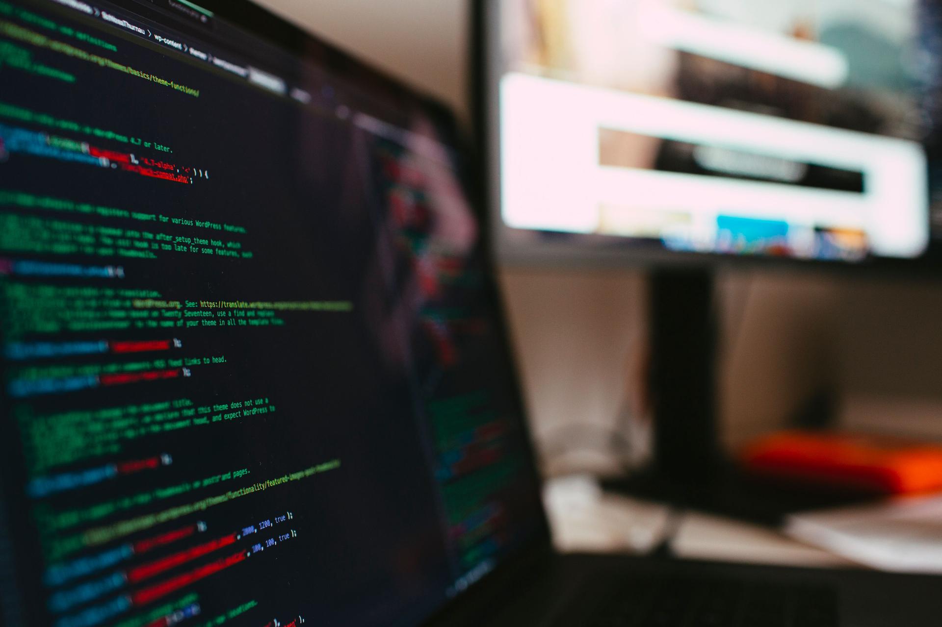 Programming text displayed on a laptop screen