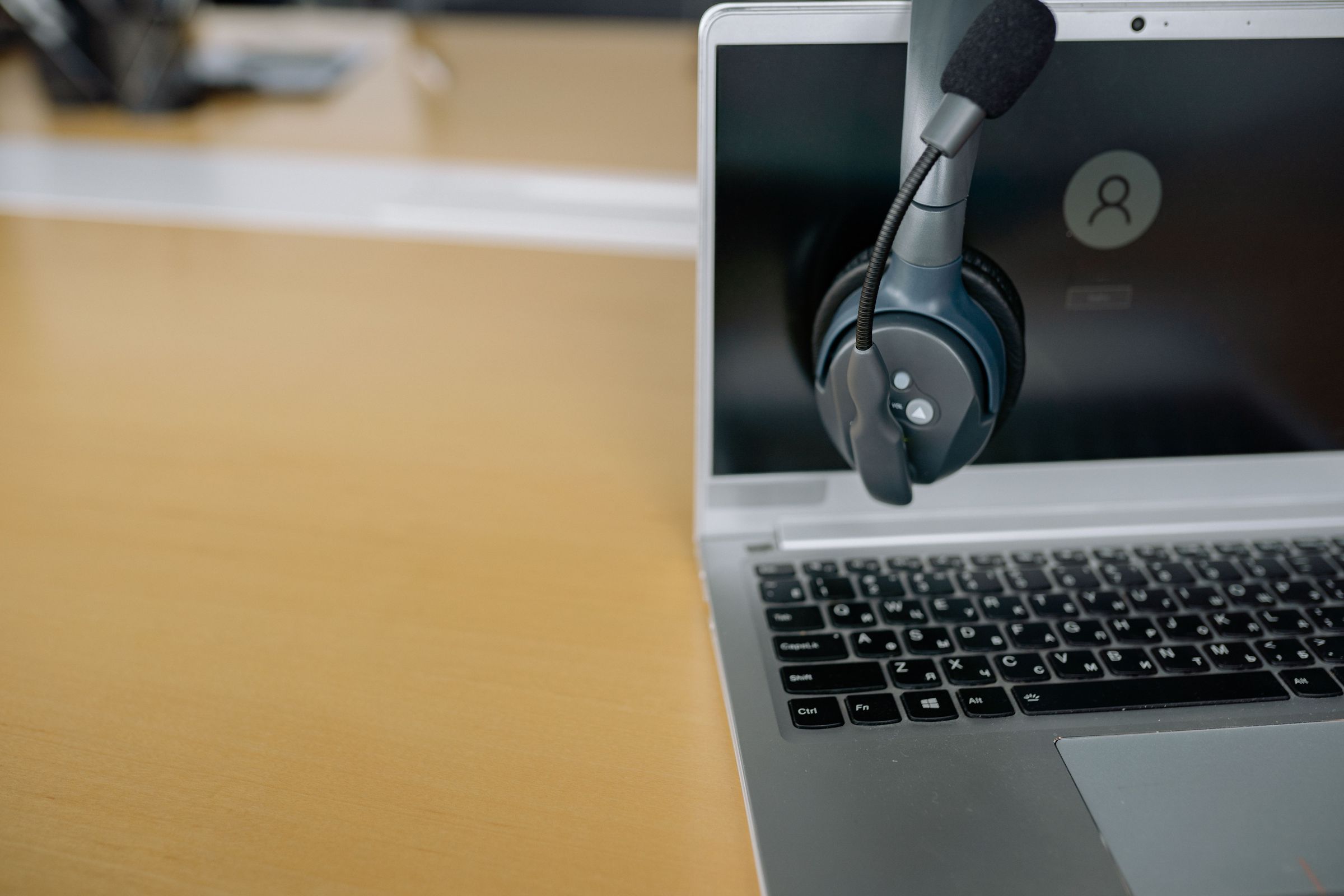 A headset and laptop illustrating a support communication channel