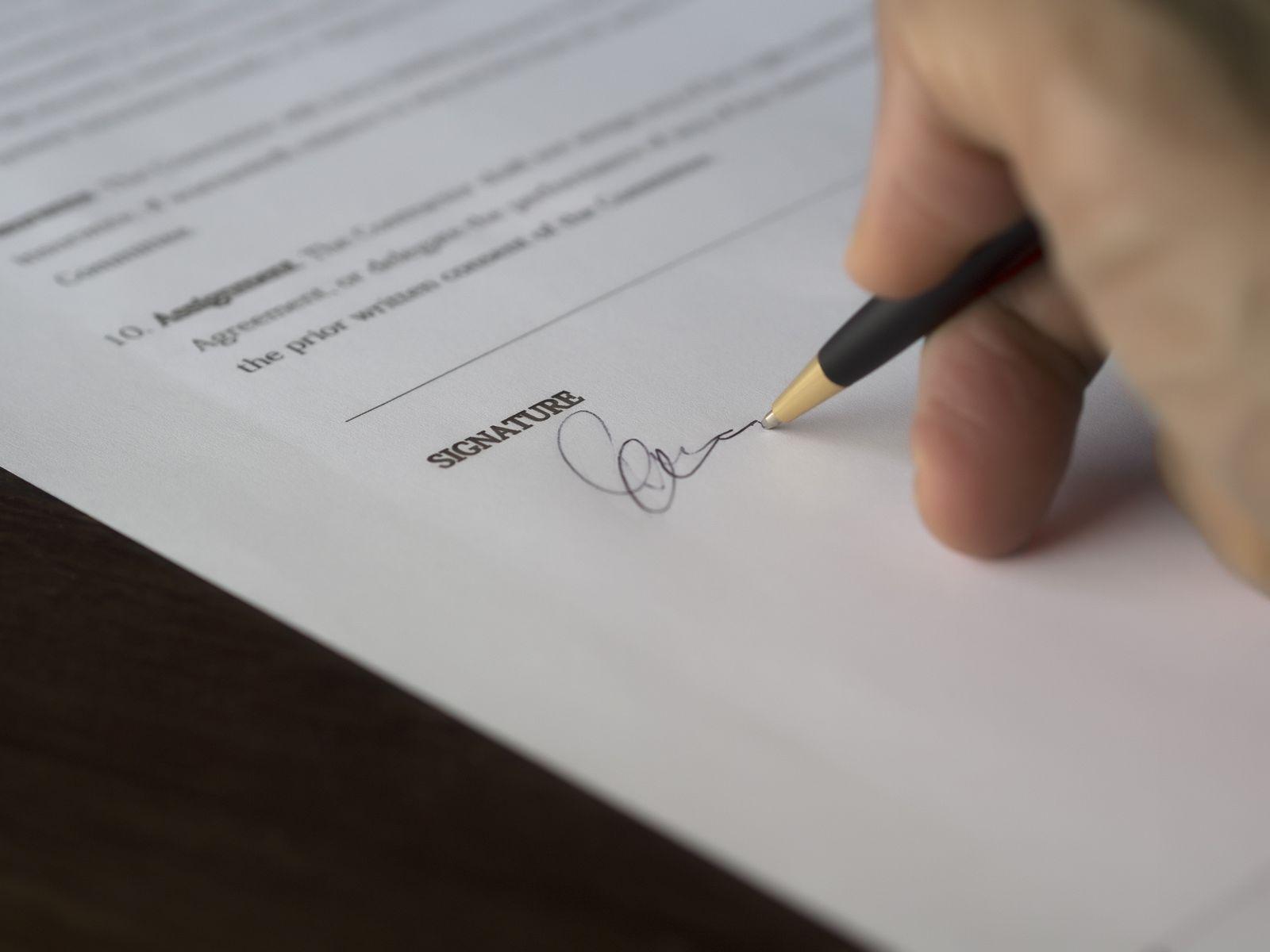 Signing a contract covering website ownership and handover