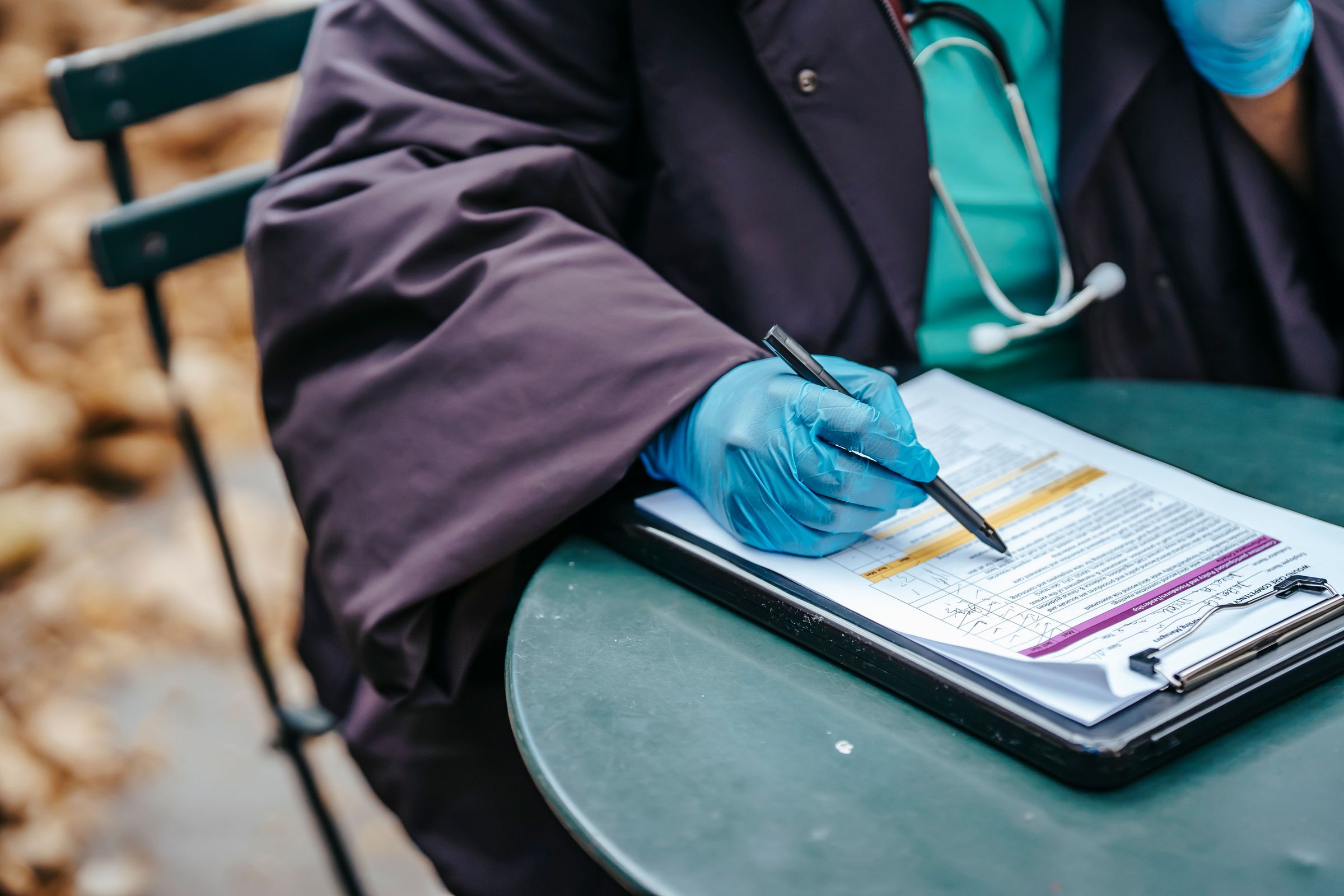 Paper form review on a clipboard