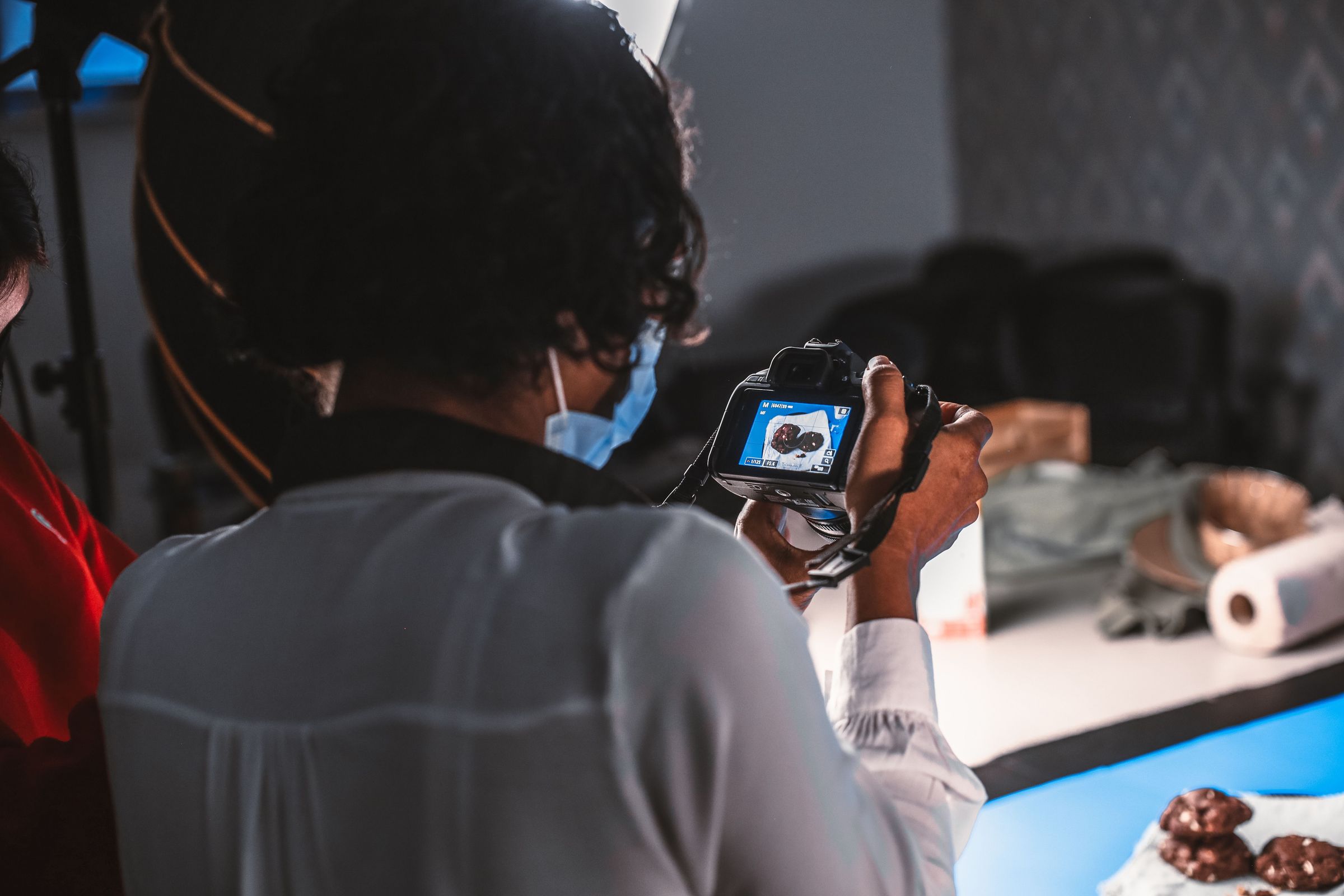 Photographer taking a food product photograph in a studio