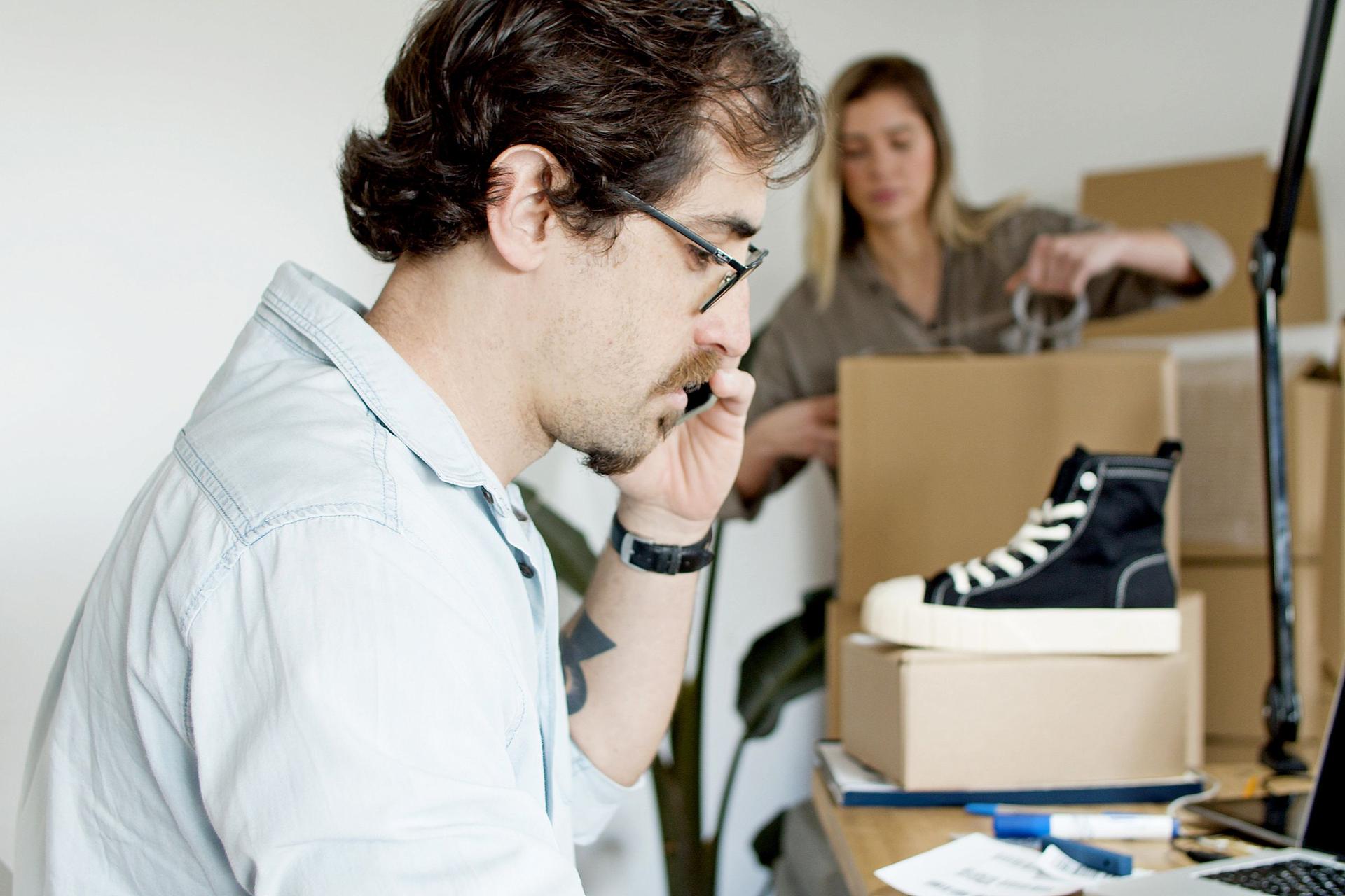 Small business owners preparing ecommerce orders for customers in Oman