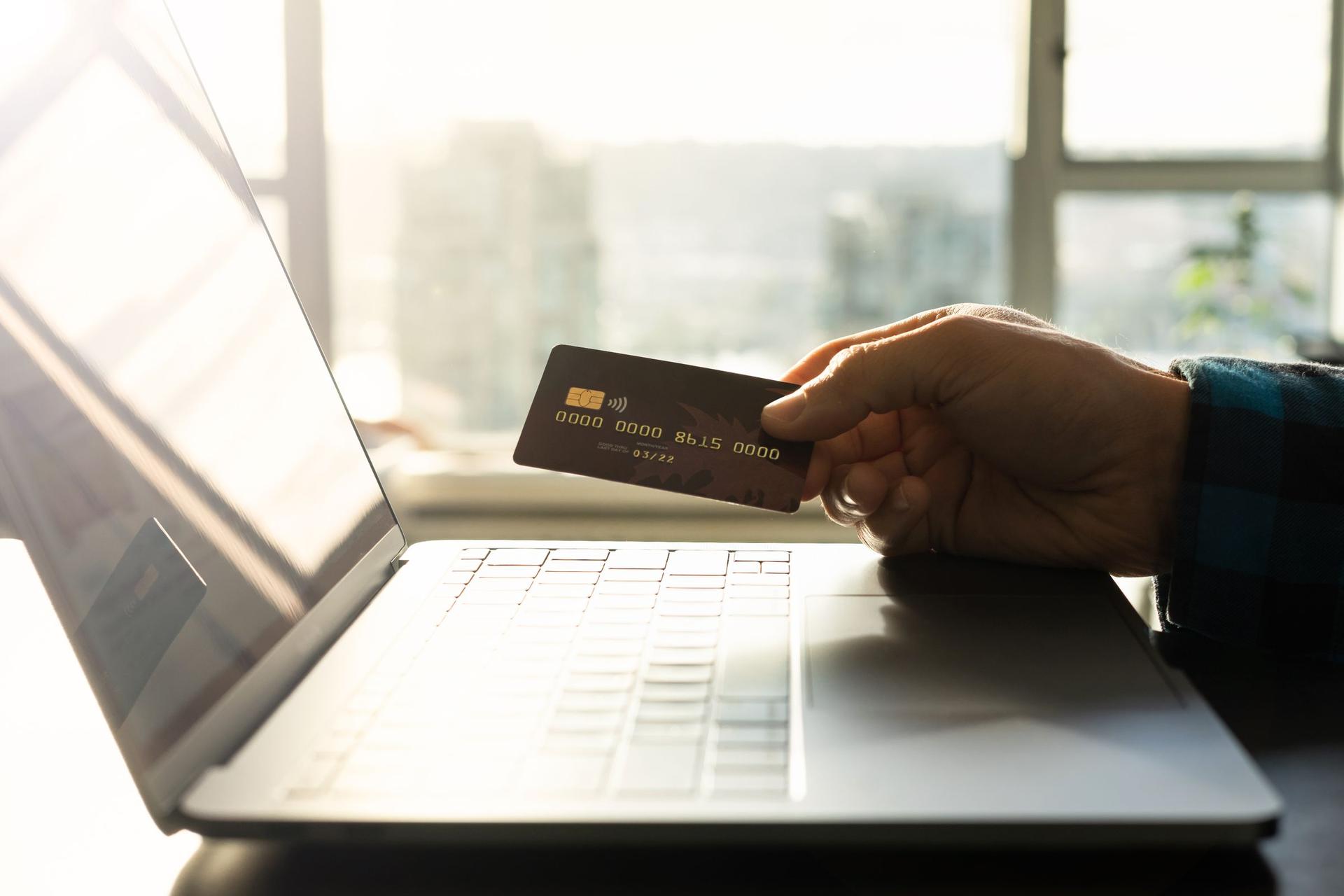 Phone and laptop showing digital payment for a Saudi online store