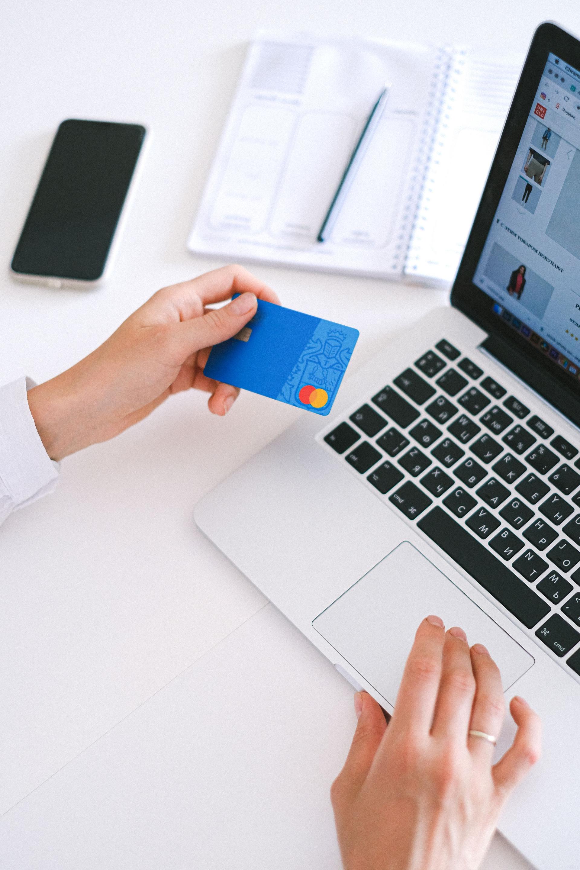Phone and laptop showing digital payment for a Saudi online store
