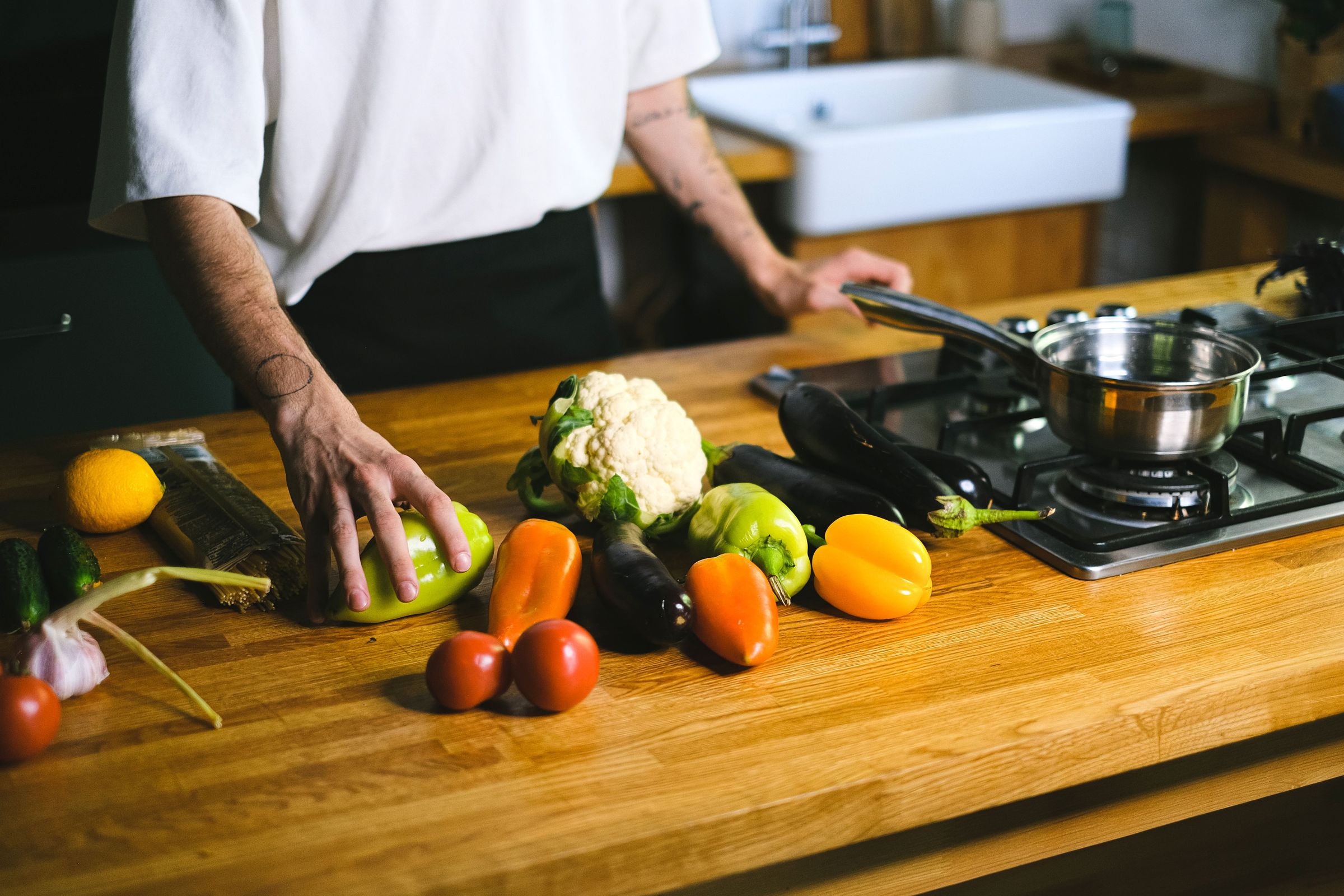 Person preparing vegetables on a kitchen counter
