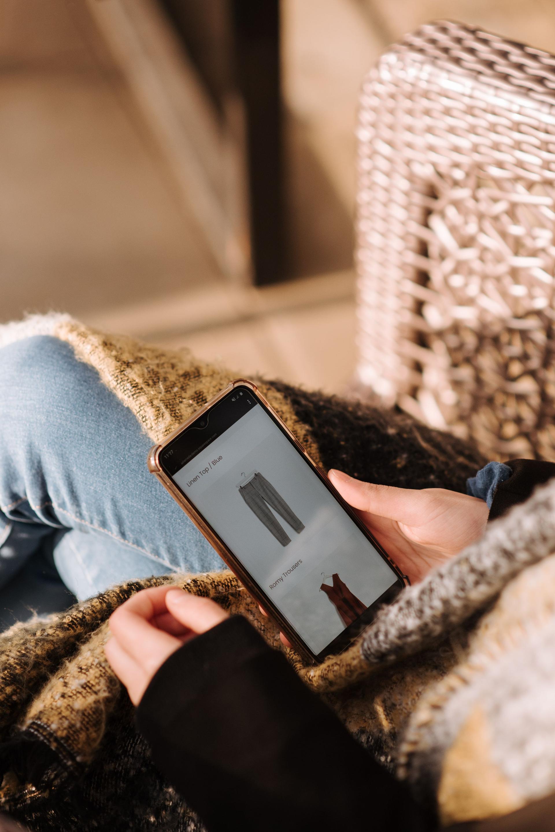 Customer browsing a responsive e-commerce website on a smartphone