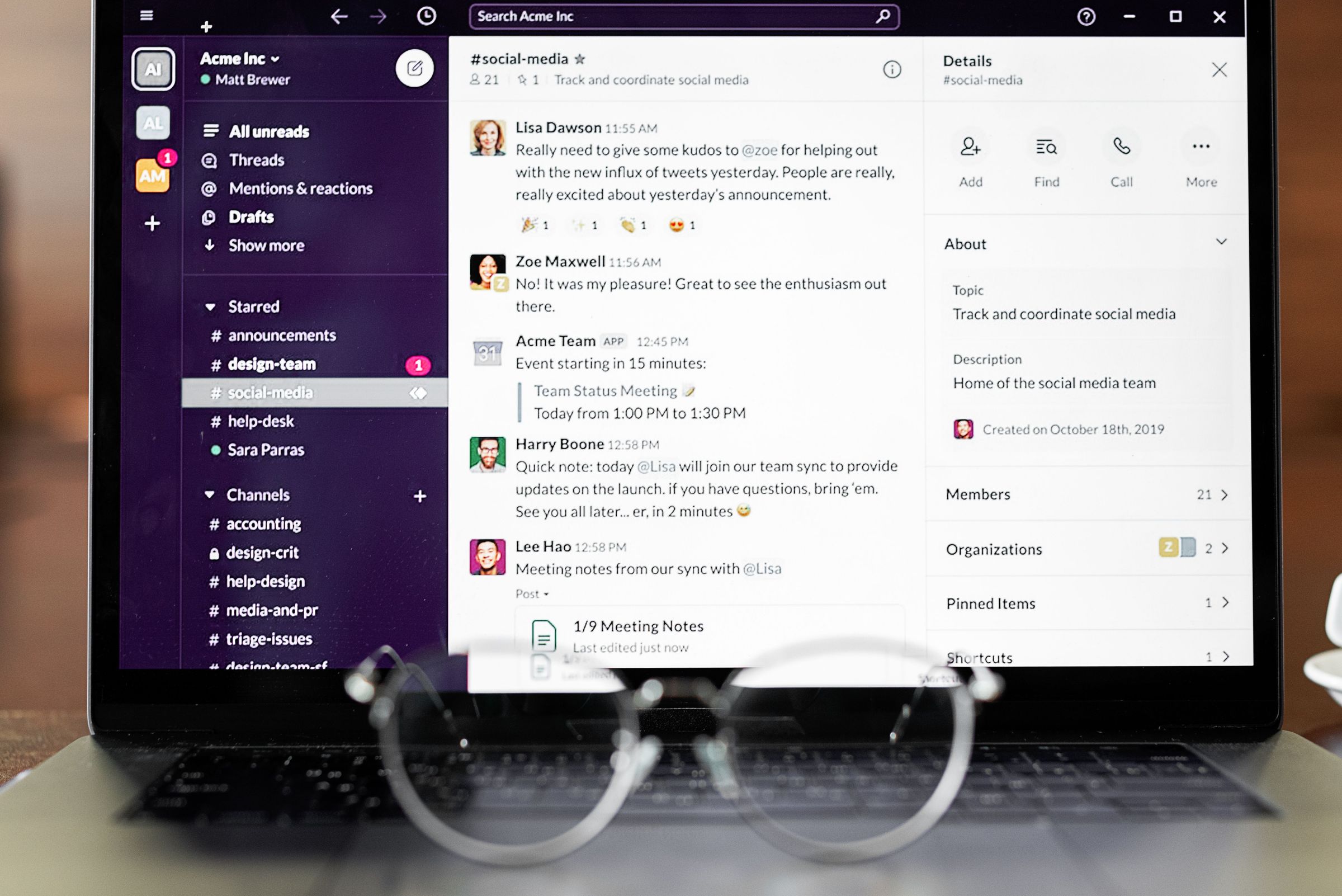 Digital messaging interface on a laptop with eyeglasses in the foreground