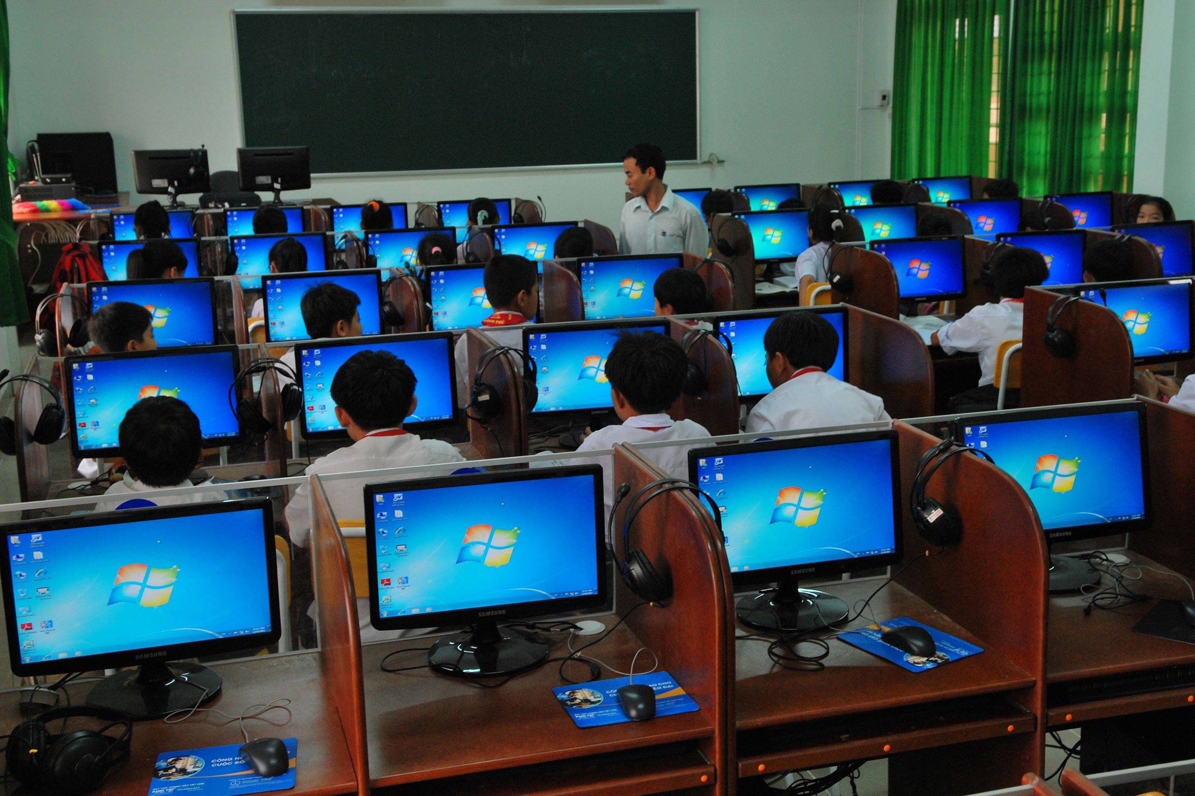 Students using desktop computers in a classroom