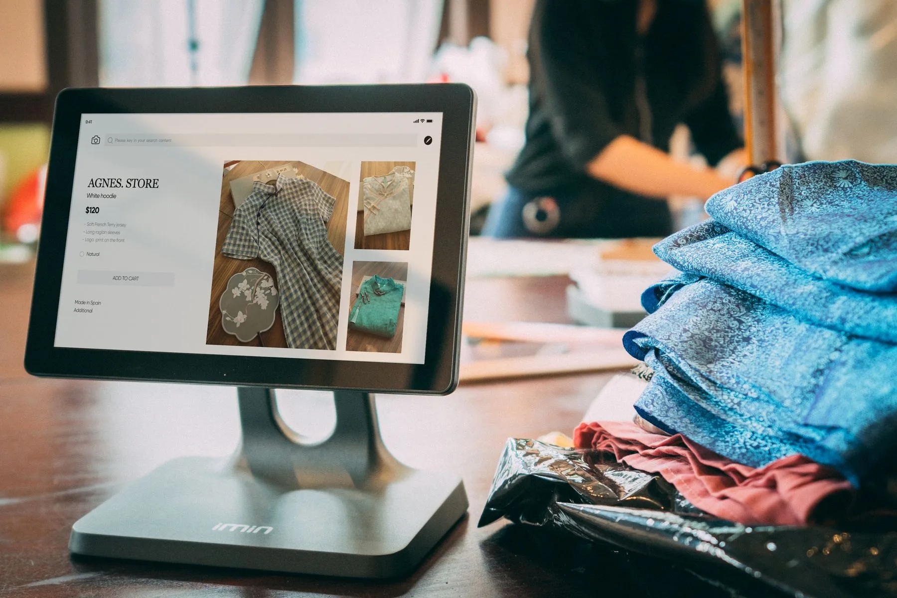 Online store owner managing orders on a tablet