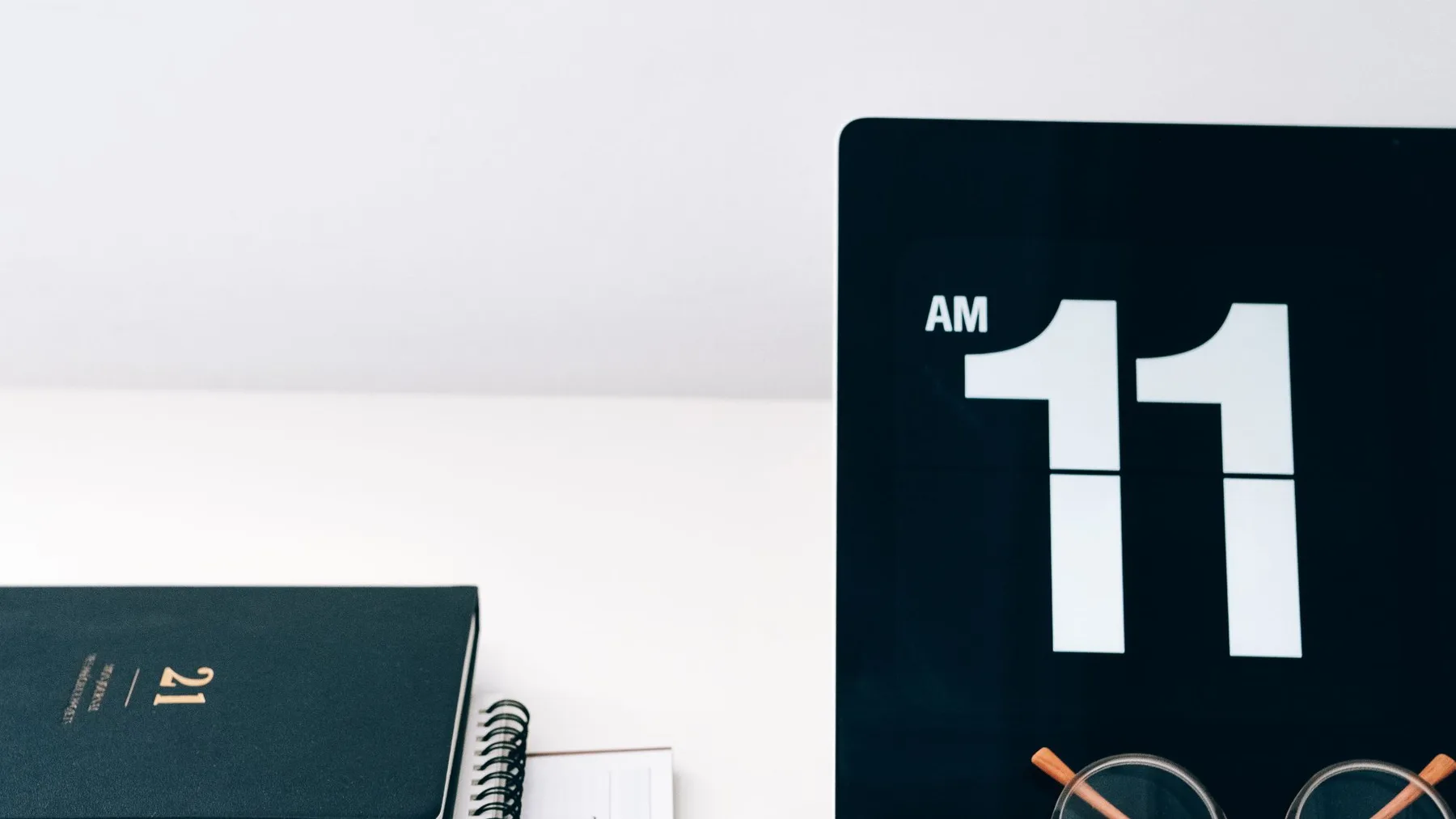 Laptop, calendar, and desk tools for planning website delivery weeks
